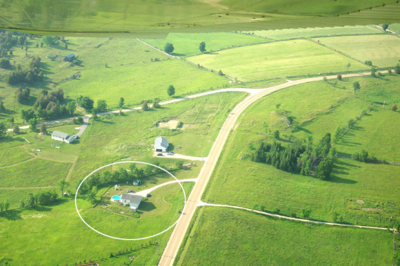 An aerial shot of our house on a hill