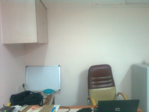 This is my office desk. Of course I am taking the photograph so I am not on the seat :)