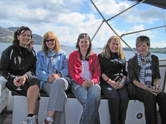 Our Sea Faring Girls on a Team Building Trip aboard the Westwinds Cruiser - discussing work of course, while we sail round Ailsa Craig and into Lamlash Bay in Arran
