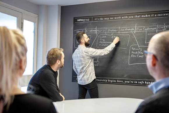 All eyes are on Jon as he runs through a business presentation in our meeting room.